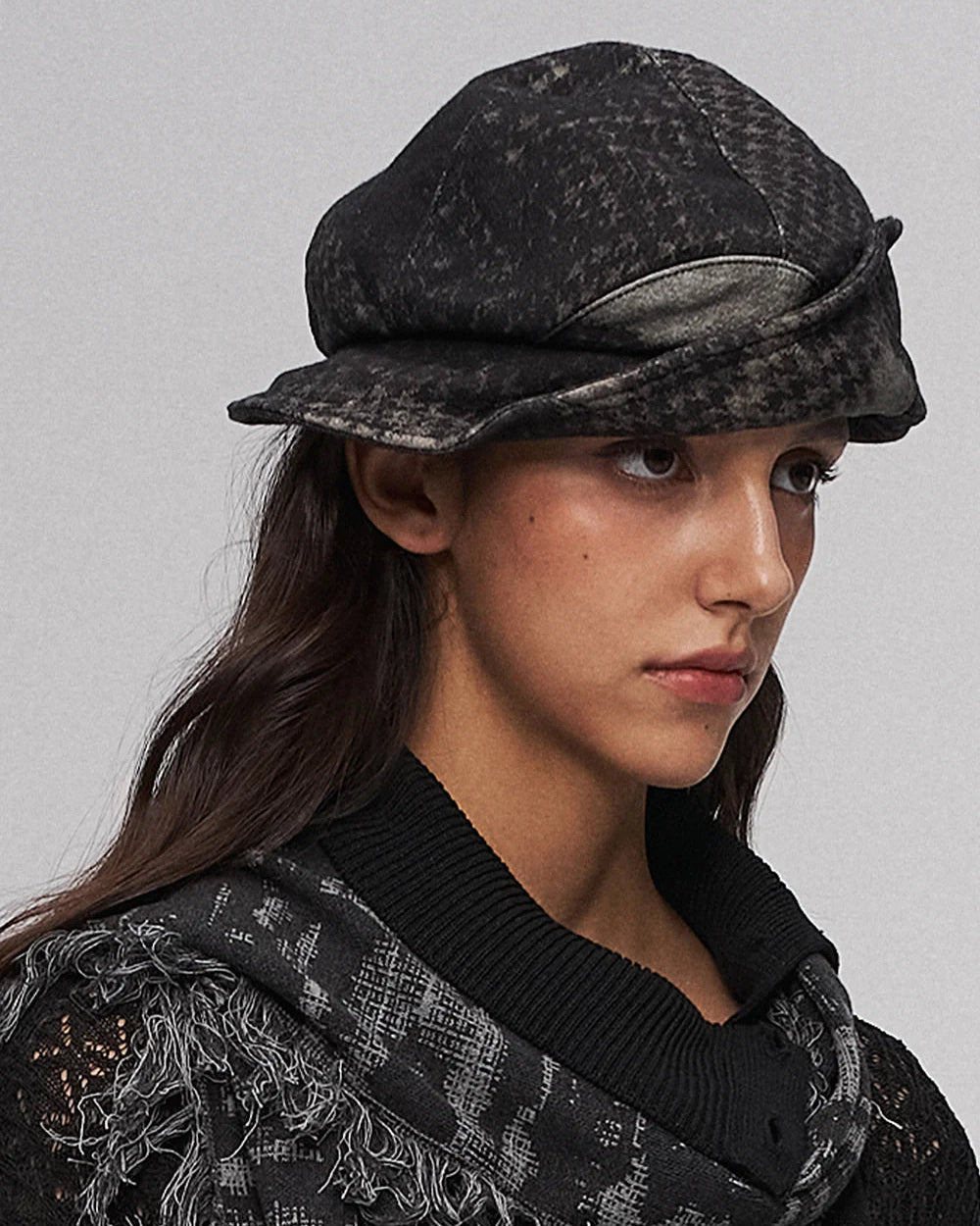 Fold-down, oddly shaped hat in black and green