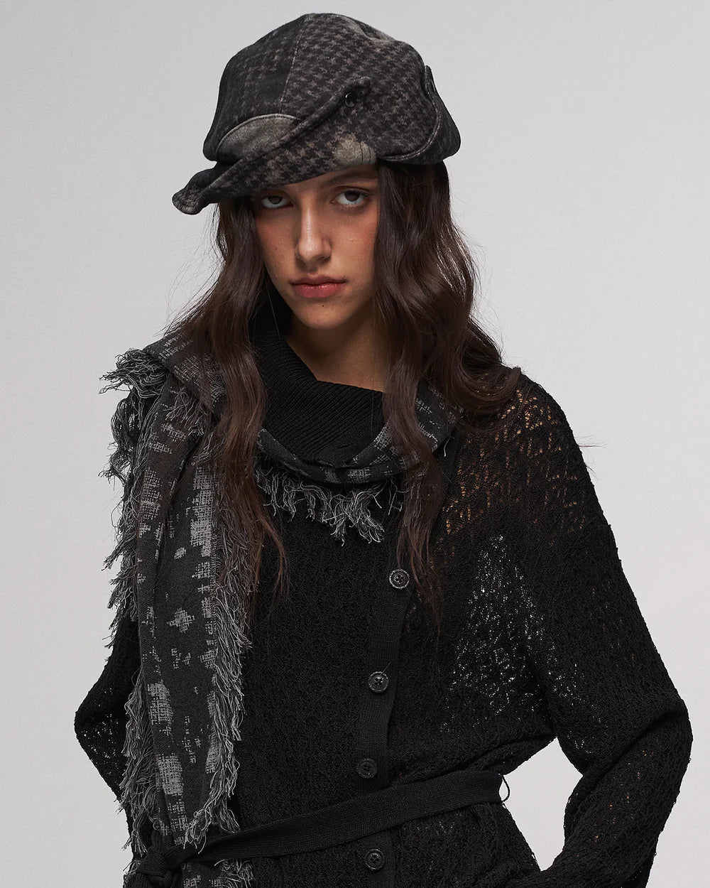 Fold-down, oddly shaped hat in black and green