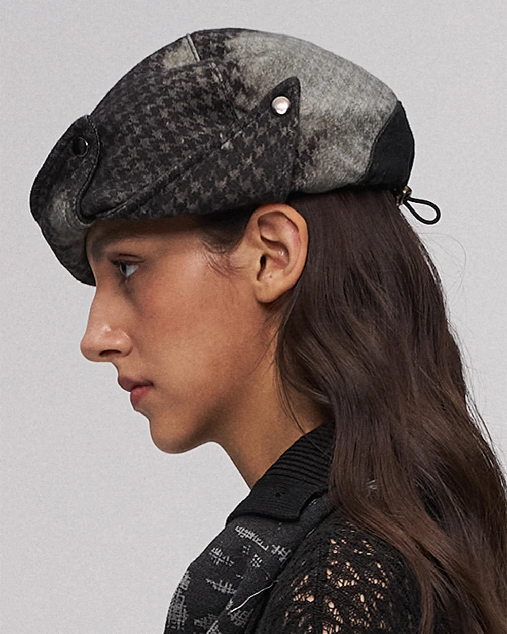 Fold-down, oddly shaped hat in black and green