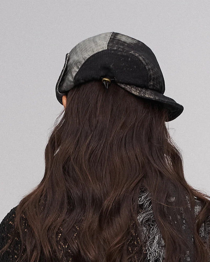 Fold-down, oddly shaped hat in black and green