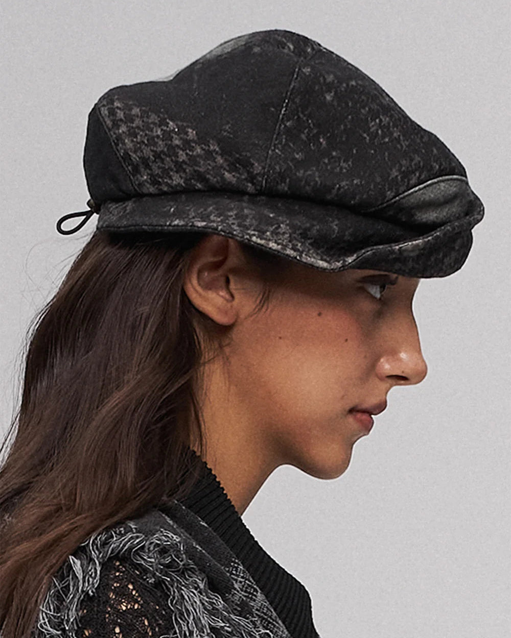 Fold-down, oddly shaped hat in black and green