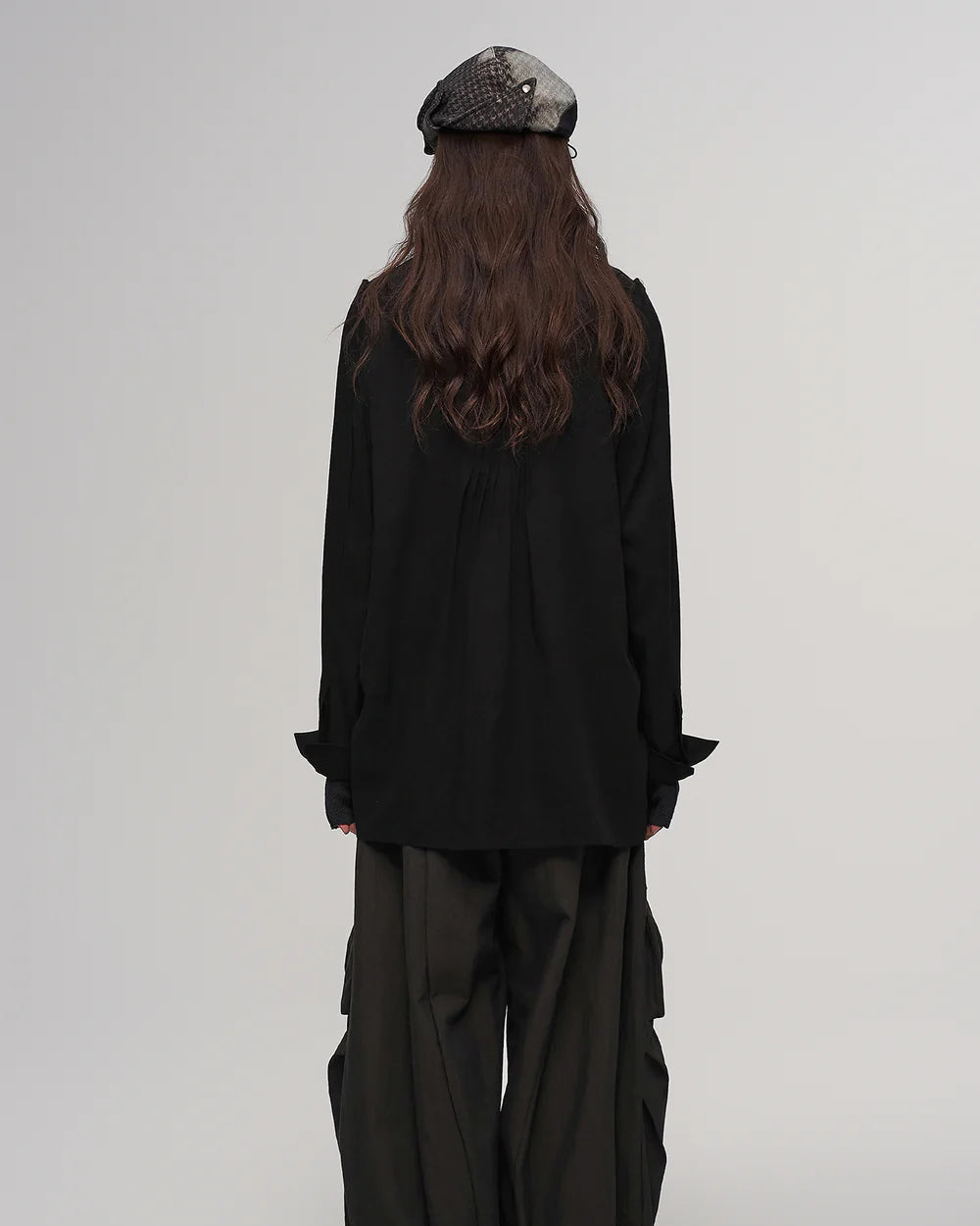 Fold-down, oddly shaped hat in black and green