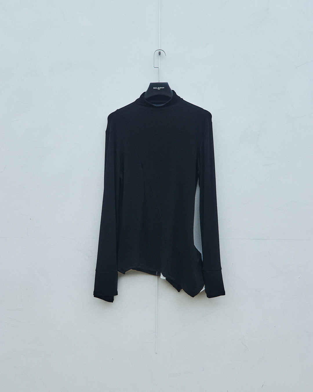 Black knit sweater with finger gaps