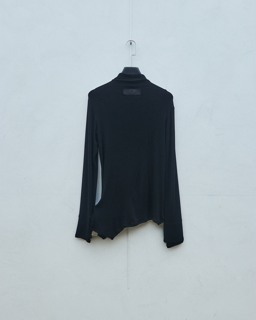 Black knit sweater with finger gaps