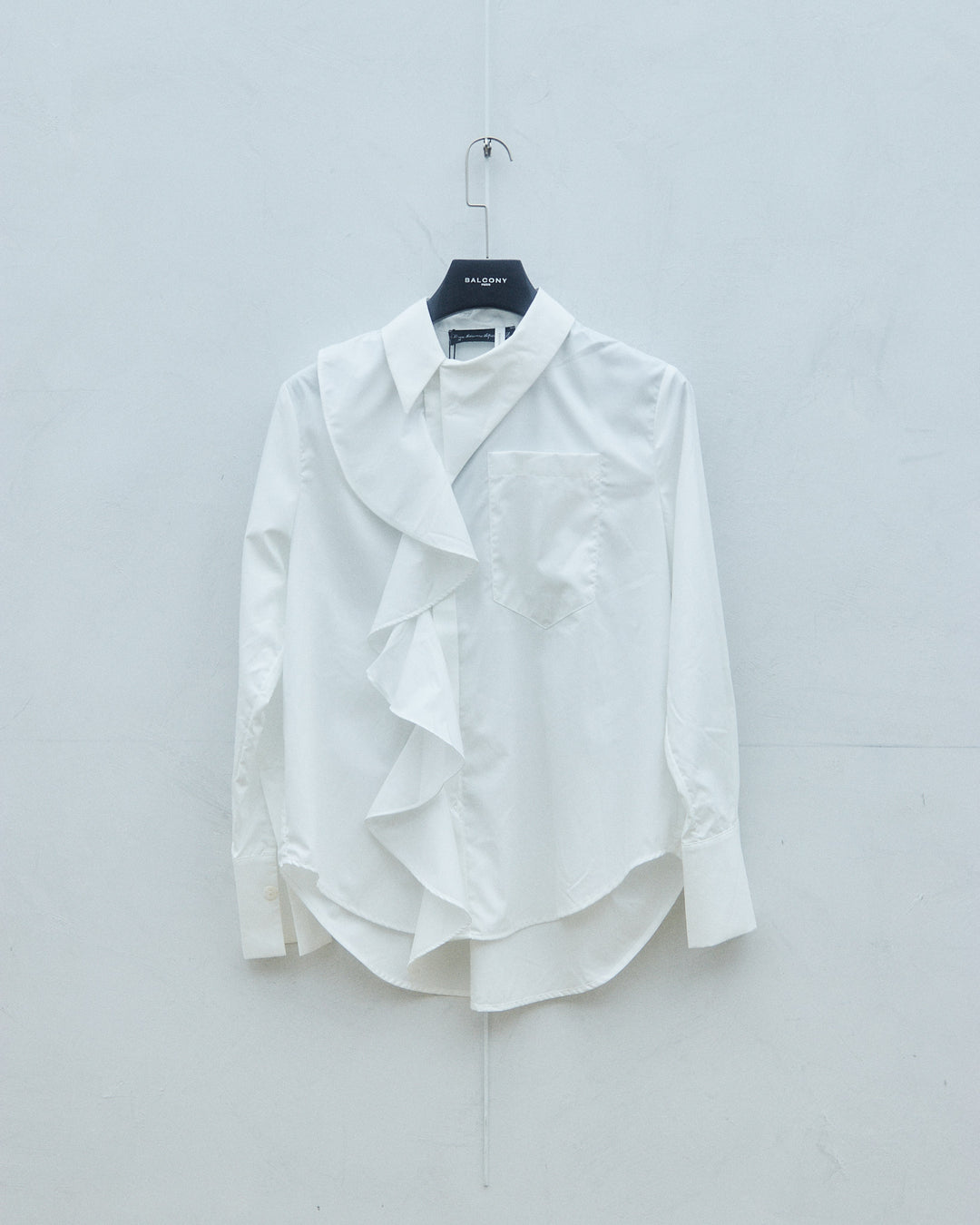 White court-style ruffled blouse
